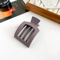 Detail of matte rectangular hair claw clip in smoky grey against lifestyle decor - Matte Purple Gray