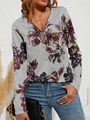 Detail eines grauen Langarmshirts mit Reißverschluss-V-Ausschnitt und Blumenmuster - S / Oberteile / Grau