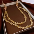 Detailed macro view of double-layer yellow gemstone beaded necklace in jewelry gift box - Double Layer Citrine/Warm Yellow