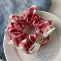 Red plaid scrunchie with lace trim, ribbon bow, and a small brown bear accent - Scarlet Plaid Lace Bow
