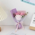 Detailed macro view of a pink soap rose bouquet with elegant ribbon and paper wrapping - Lotus root pink