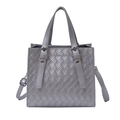 Grey woven texture handbag with dual handles and adjustable shoulder strap on white background - Silver