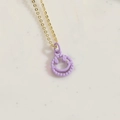 Minimalist gold necklace with a light purple smiley face pendant and gear edge - Purple