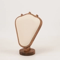 Close-up of beige velvet jewelry bust display with a solid natural wooden base stand - Walnut Beige Velvet