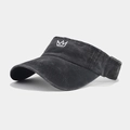 Close-up of black washed cotton sun visor hat with white embroidered crown logo details - Adjustable / Black