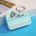 Light blue mini piano keychain with seven numbered white keys and music theme design - Bag Packaging / Macaron Blue