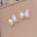 Macro view of gradient aurora butterfly earrings with gold plating and zircon details - White