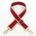 Detail of red and beige geometric woven wide shoulder strap with golden metal clasps - Burgundy