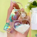 Rainbow heart liquid quicksand keychain with holographic PVC strap and gold hardware - White