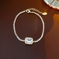 Gold plated tennis bracelet with pink shell flower and emerald cut zircon centerpiece - Rectangular Zirconia Claw Chain Bracelet