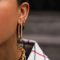 Stylish gold twisted hoop earrings with geometric design and matching metal chain necklace - Gold