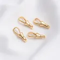 Nahaufnahme von runden und ovalen Federringen aus 14K Gold für DIY-Schmuckherstellung - 14K Gold Langer Karabiner 23x8mm