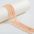 Faceted light orange crystal beads strand for DIY jewelry making on white display - 4mm / Pale Orange