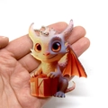 Cartoon acrylic baby dragon Christmas ornament holding a red gift box hanging decoration - Red