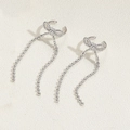 Elegante polsino per orecchio a fiocco argento con lunghe nappe a catena - Clip per Orecchie con Nappa e Fiocco Argento