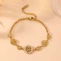 Detailed view of gold chain bracelet with Tree of Life charms and sparkling crystal heart - Gold Tree of Life Style (L810) / Gold