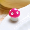Macro shot of a small pink mushroom figurine with white dots for micro landscape DIY - Rose Red