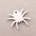 Polished stainless steel spider pendant for Halloween jewelry making on beige background - Spider Pendant / Steel