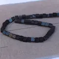Macro shot of 8mm square blue goldstone beads with glittering stars for DIY jewelry - Blue Sandstone