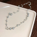 Close-up of double-layer irregular glass pearl necklace with silver chain on velvet - Necklace-Silver-Grey