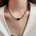 Detail of beaded necklace with brown amber tones and black rectangular gemstone pendant - 22# Necklace - Gold-Brown (Black Rectangular Main Stone Style)
