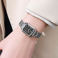 Women's square silver quartz watch with black dial and metal strap on wrist - Silver Band Black Dial