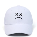 White cotton baseball cap with black embroidered sad face emoji and adjustable strap - White