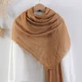 Solid ginger cotton linen scarf with natural crinkle texture and fringed edges on hanger - Ginger Yellow
