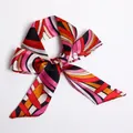 Pink and red geometric pattern ribbon scarf tied in a stylish bow for handbags - S11-Lively Geometric Print
