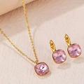 Golden stainless steel jewelry set featuring square pink cubic zirconia pendant and earrings - Pink