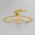 Detail of adjustable gold slider bracelet with a sparkling zircon floral clover pendant - Gold White Zirconia