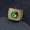Macro shot of 316L gold stainless steel ring with green emerald cut stone and diamonds - US 7 / Gold Green Stone