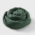 Dark green cotton linen scarf styled in a rose shape with natural soft texture - Green