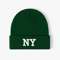Close-up of high-quality dark green knit beanie with white NY letter embroidery detail - One Size / Dark Green