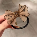Elastic hair tie with champagne polka dot mesh bow and amber crystal cluster detail - Coffee Bowknot Rhinestone Hair Tie 1Pc