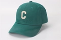 Detailed view of dark green baseball cap with white embroidered letter C on cotton fabric - Kids (2-8 Years) / C Letter Grass Green