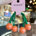 Kids elastic hair tie with bright orange sphere charm on green rope, contrast colors - Orange