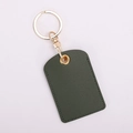 Detail of dark green leather access card holder with gold hardware and stitching - Square / Dark Green