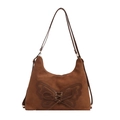 Brown suede tote bag with butterfly cut-out design and woven details on white background - Brown