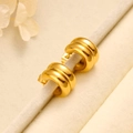 Close-up of golden double-layered C-shaped hoop earrings on a beige display stand - Gold
