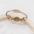 Rose gold watch-style bracelet with triple floral design and sparkling crystal accents - 360 Rose Gold Bangle (360 Rose Gold)