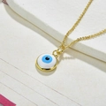 Detailed view of the gold-plated Evil Eye pendant with blue and white enamel inlay - Necklace Set-Light Blue