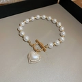 French vintage pearl bracelet with a gold heart pendant and sparkling rhinestone details - Rhinestone Heart OT Buckle Pearl Style