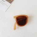Foldable vintage kids sunglasses with transparent amber frames and dark lenses - Brown