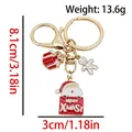 Golden Christmas keychain with enamel charms of a gingerbread man and gift box - ER1800-Santa Gift Box 8-shape Keychain