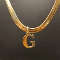 Elegant gold-plated snake chain necklace featuring a polished letter G initial pendant - Letter G (5592272000727)
