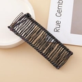 Black metal banana hair clip featuring colorful wire wrapping on a beige background - 30 Teeth / Multicolor/Black