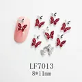 Detalle de adorno para uñas de mariposa 8x11mm con cristales rojos y base plata - Plateado Rojo con Diamantes