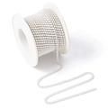Close-up detail of white pearl rhinestone claw chain on a spool for DIY jewelry - 10 Yards/Roll