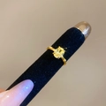 Macro shot of gold oval yellow gemstone ring with fine textured triple-layer band - Gold-Yellow